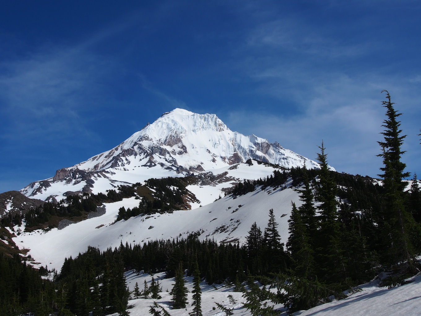 A close-in photo of a snow-covered mountain.